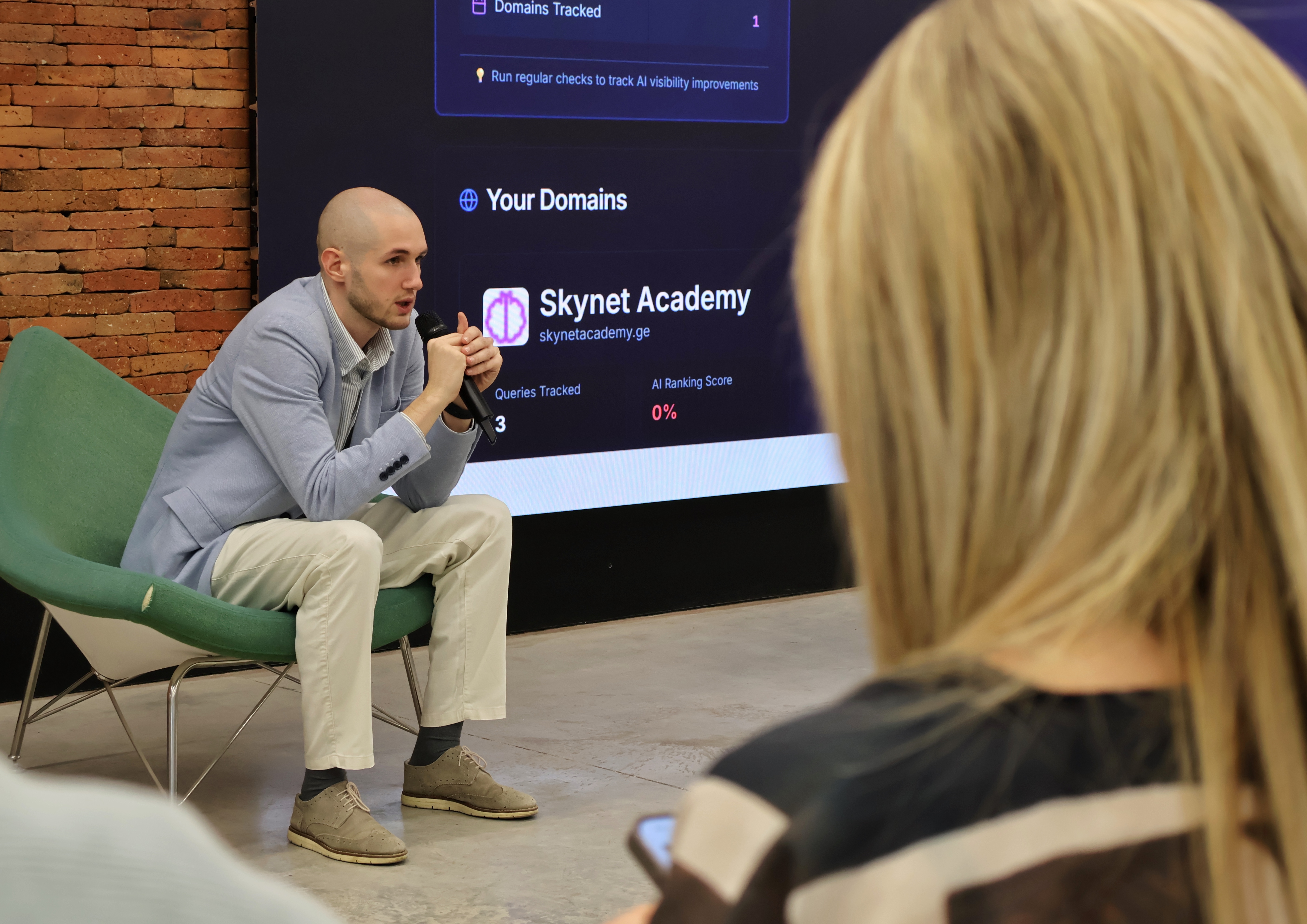 Giorgi Muzashvili speaking at an AI & Marketing event